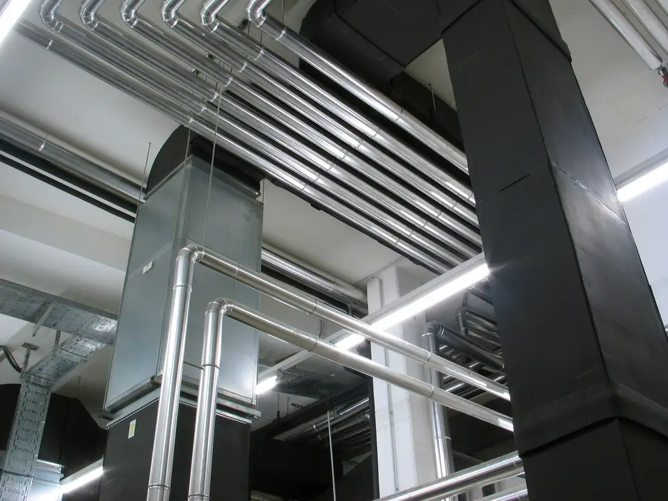 Mechanical room with boiler and heating pipes
