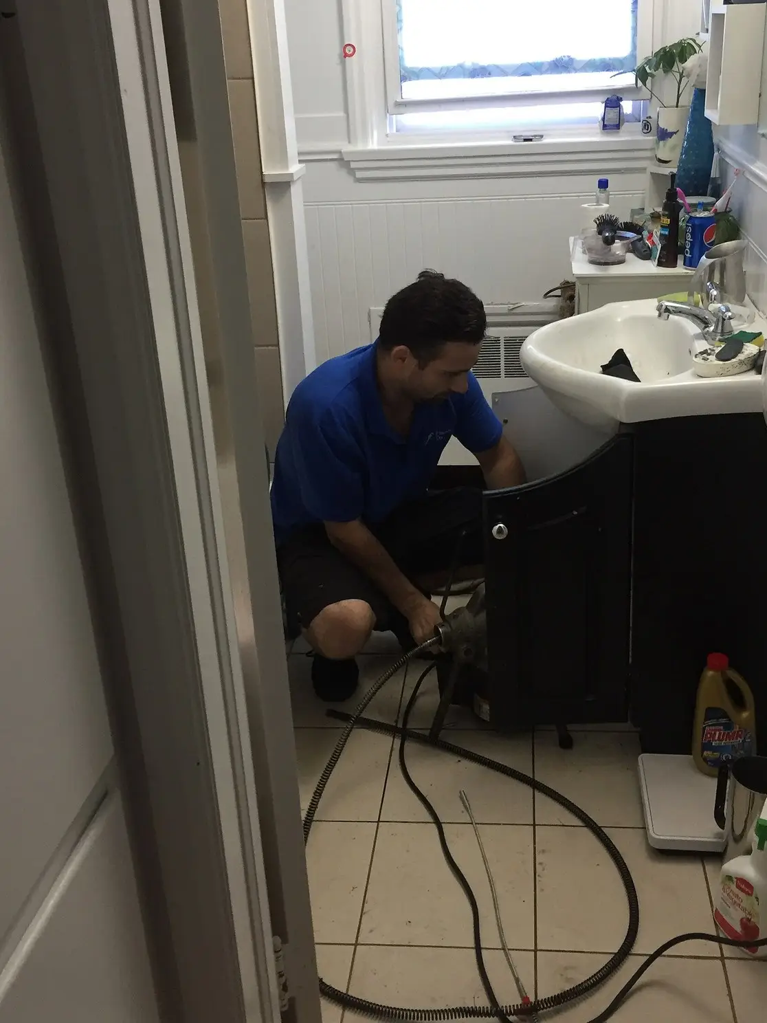 Licensed plumber working on a residential repair